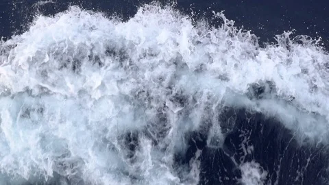Slow motion sea wave splashes on a blue water surface Stock Footage 118073712
