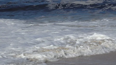 Slow motion of sea waves in close up. FRONT VIEW. Stock Footage 127157108