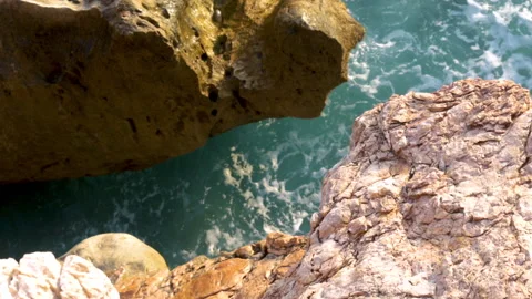 Slow motion sea waves hitting seashore Stock Footage 218826482