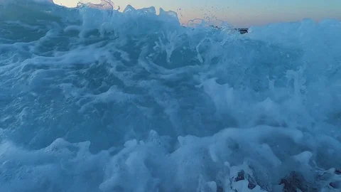Slow Motion Of Sea Waves sunset . Sea Sunrise, Beach And Dancing Splashing Waves Stock Footage 121309948
