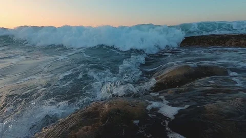 Slow Motion Of Sea Waves sunset . Sea Sunrise, Beach And Dancing Splashing Waves Video stock 121310012