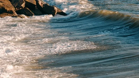 Slow motion seagulls flying over sea waves during stormy weather at daytime in Stock Footage 121533741