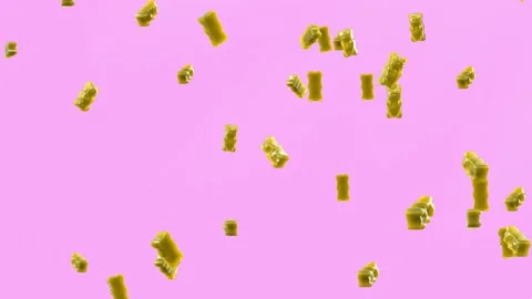 Slow Motion. Seamless Loop Background. Gummy bears candy. Yellow jelly candy  스톡 동영상 197014875