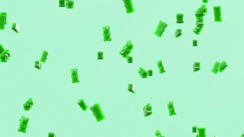 Slow Motion. Seamless Loop Background. Gummy bears candy. Green jelly candy bear 動画素材 197015187