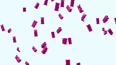Slow Motion. Seamless Loop Background. Gummy bears candy. Pink jelly candy bears Stock Footage 197015977