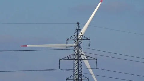 Slow motion seamless loop close up shot white wind turbine blue sky clouds clean Stock Footage 101543045