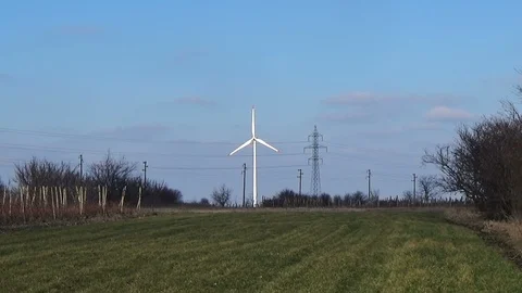 Slow motion seamless loop wind park farm renewable eco green energy blue sky Stock Footage 101543224