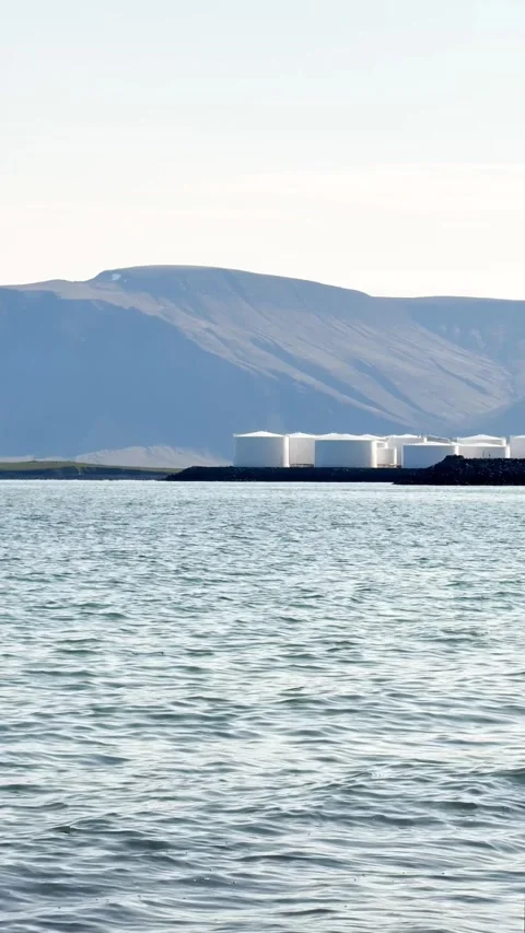 Slow motion, seascape vertical video, view of huge white tanks, oil and fuel Stock Footage 329155301