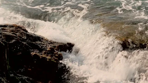 Slow motion seaside - Sparkling fresh wavy water 動画素材 77748286