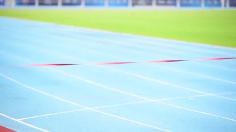 Slow motion selective focus at two young Asian boy running on blue track to the  Stock Footage 67190993