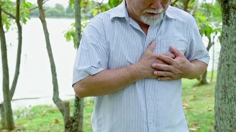 Slow motion of senior man having a stroke in park. Stock Footage 92296502