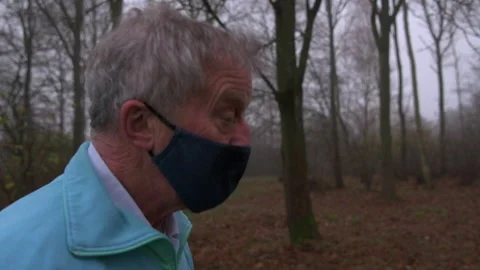 Slow Motion Senior Man Jogging in Park Close Up Stock Footage 152425453