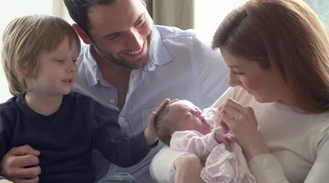 Slow Motion Sequence Of Family On Sofa With Newborn Baby Stock Footage 43308098