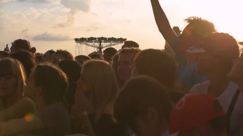 Slow motion sequence of hands of dancers at party shot against the sun. Shot on 動画素材 101021568