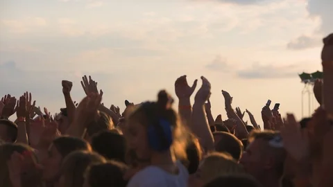 Slow motion sequence of hands of dancers at party shot against the sun. Shot on 動画素材 101021690