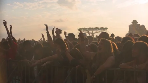 Slow motion sequence of hands of dancers at party shot against the sun. Shot on 動画素材 101021724