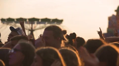 Slow motion sequence of hands of dancers at party shot against the sun. Shot on 動画素材 101021774