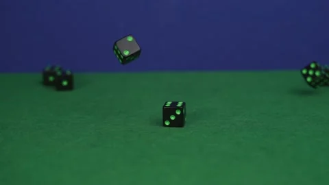 Slow motion several black dice tumbling ending with 2 dice making 7 Stock Footage 135363890