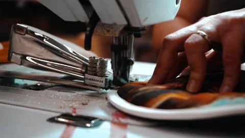 Slow motion sewing machine threading oven mitts Stock Footage 135269722