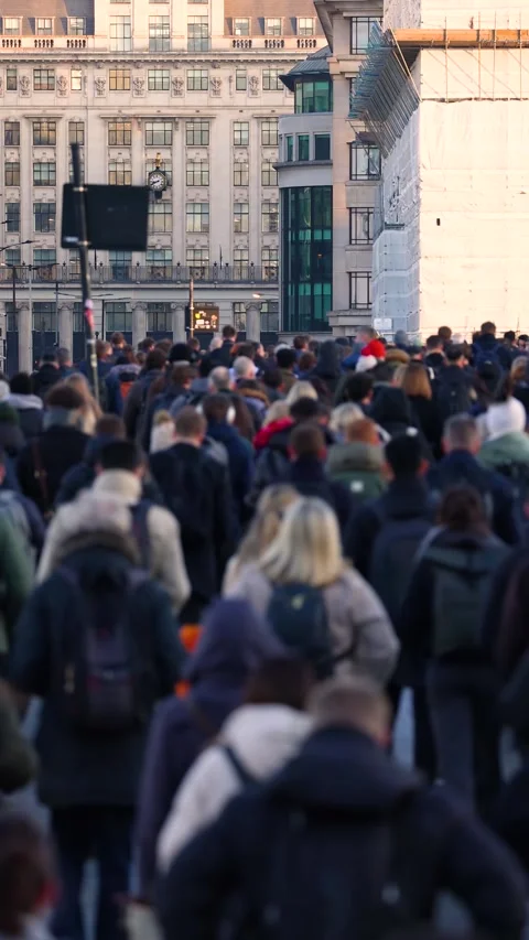 Slow motion shallow focus view of crowds of commuters Stock Footage 321135413