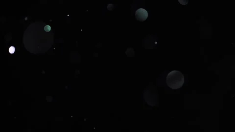 Slow-motion shimmering particles with bokeh and sparkling dust. 動画素材 322799802