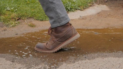 Slow Motion Shoe Stepping In Puddle Stock Footage 102181697