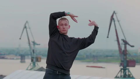 Slow motion shoot of a talented young dancing man performing various freestyle Stock Footage 105463957