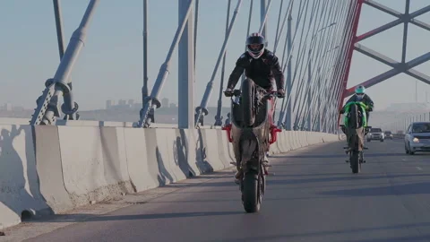 Slow motion shoot of two professional motorcyclists synchronously riding the Stock Footage 105011879