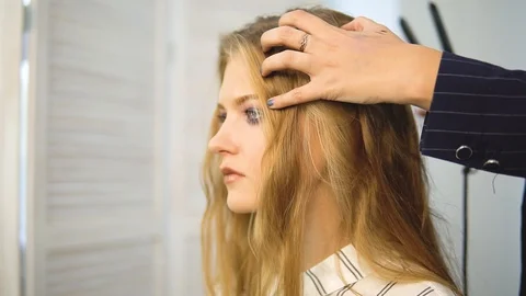 Slow-motion shooting close-up of a long dark hair of a young girl. Brilliant and Video stock 115993262