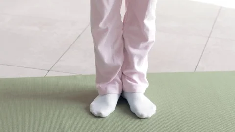 Slow-motion shooting exercises Yoga close-up. Sporty girl doing exercises on Video stock 79103547