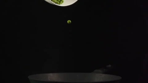 Slow motion shooting of a falling green pea	 Stock Footage 157538657