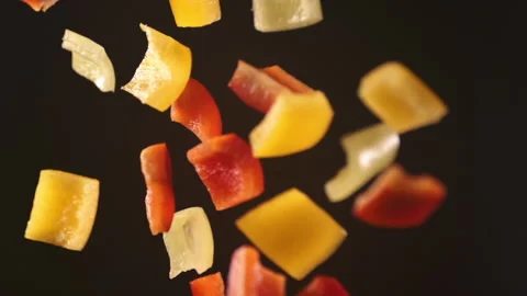 Slow motion shooting flying pieces of pepper Stock Footage 157538457