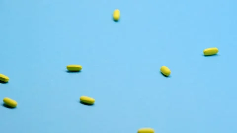 Slow motion shooting. Medication on a clean background homogeneous background, v Vídeos de archivo 142291993