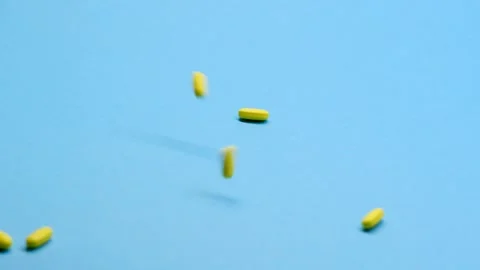 Slow motion shooting. Medication on a clean background homogeneous background, v Vídeos de archivo 142292123