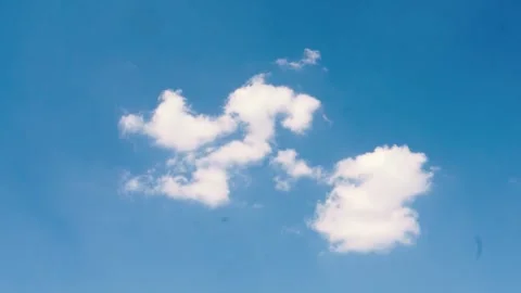 Slow-motion shooting of a piece of white cloud and blue sky. Stock Footage 252129043