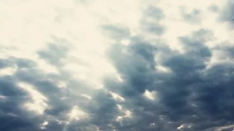 Slow-motion shooting of the silhouette of a cloud moving across the sky. Stock Footage 238633805