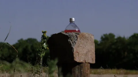 Slow Motion Shooting Things With Gun bullets &amp; Explosions Stock Footage 124245802