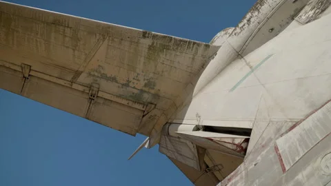 Slow-motion shooting of the wing and roof of a white ekranoplan against a clear Stock Footage 256015018