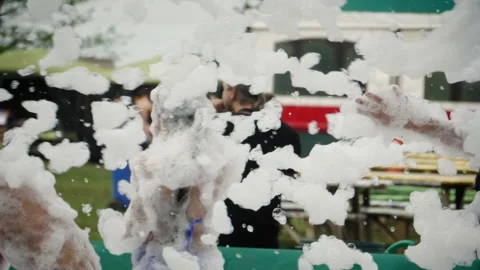 Slow motion shot: Active foam party. HD Stockbeeldmateriaal 145999664