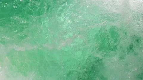 Slow motion shot of air bubbles coming out to the surface of a jacuzzi pool Video stock 203858564