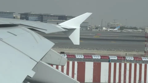 Slow motion shot of airplane pulling onto lane in airport. Hot desert morning 스톡 동영상 132168491