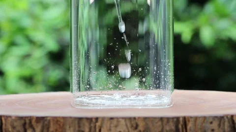 Slow motion shot of aloe vera cuts falling into water on nature background Stock Footage 258234218