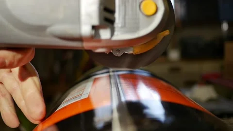 Slow motion shot of angle grinder grinding metal canister. DIY recycling projet Stock Footage 143574080