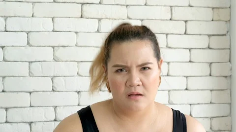 Slow motion shot of Asian plus size girl is running in fitness room Stock Footage 116744891