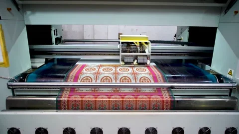 Slow motion shot of automatic color printing machine in textile factory in P Stock Footage 199272267