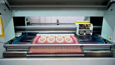 Slow motion shot of automatic color printing machine in textile factory in P Stock Footage 199272335