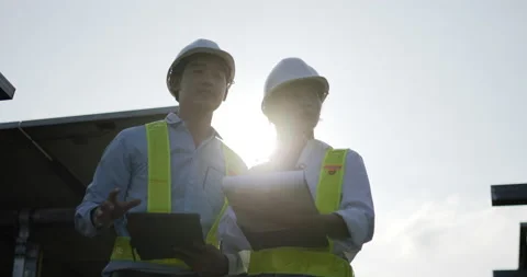 Slow motion shot, Backlit view Asian Young Inspector Engineer man and female Stockbeeldmateriaal 224416637