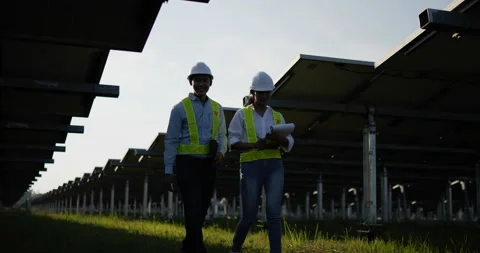 Slow motion shot, Backlit view Asian Young Inspector Engineer man and female Stockbeeldmateriaal 224419114