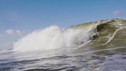 Slow motion shot of a beautiful wave breaking on the coast of the Netherlands 4K Video stock 141901152