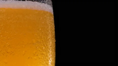 Slow Motion Shot of Beer Bubbles in Glass Stock Footage 153668300